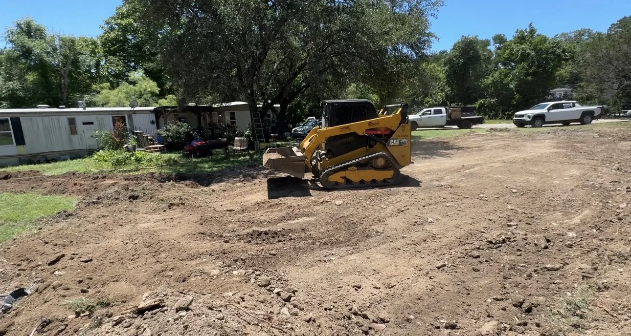 CAT 259D grading jobsite