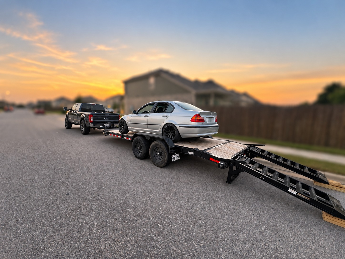 Front view of car loaded on equipment trailer