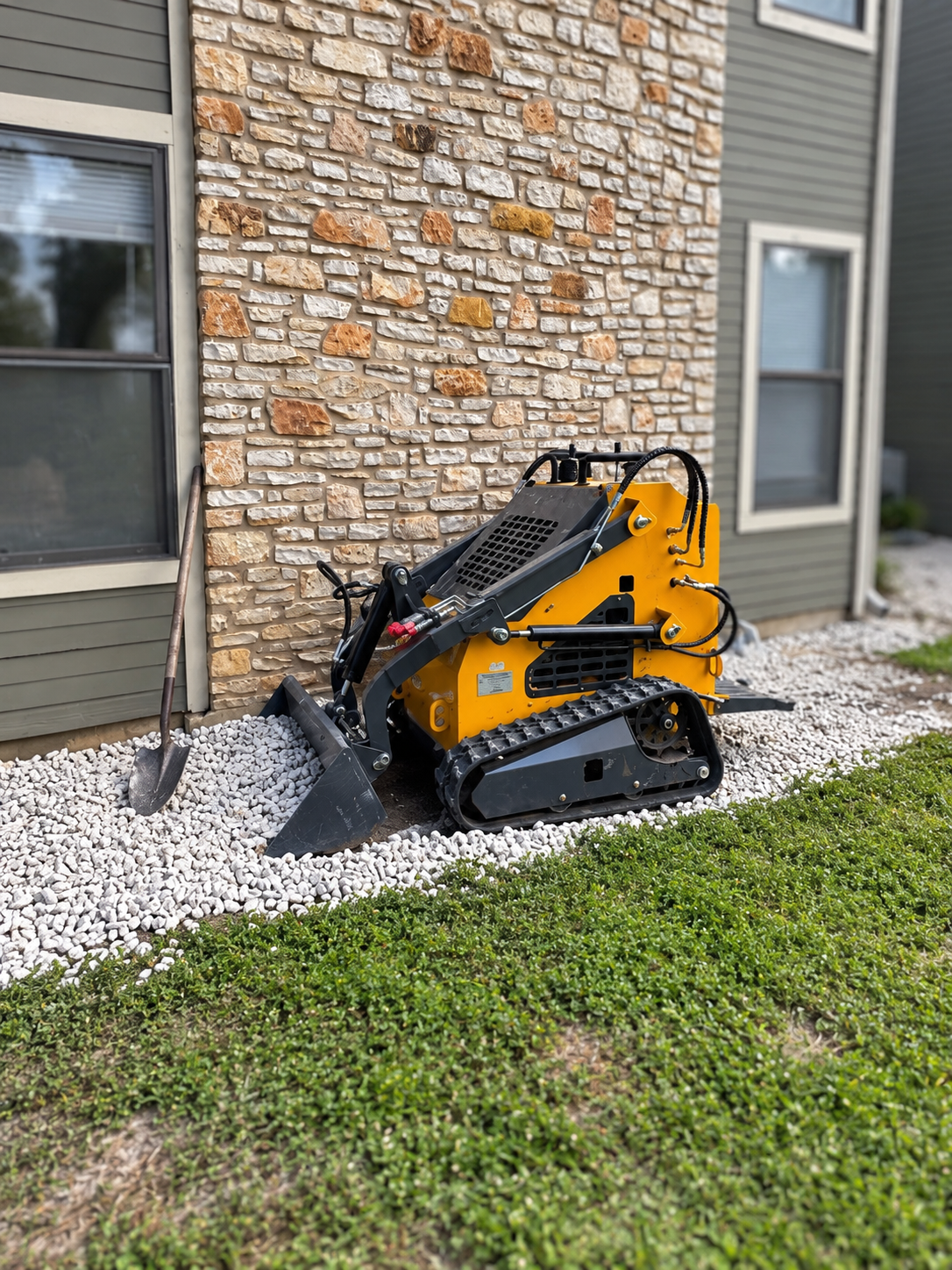 ZJ-380 mini skid steer beside a house
